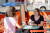 Two ladies having coffee at a parklet in Lethbridge