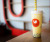 a yellow coloured umami bubble tea is sitting on the counter of the umami store with a sign hanging behind it in Lehtbridge Alberta.